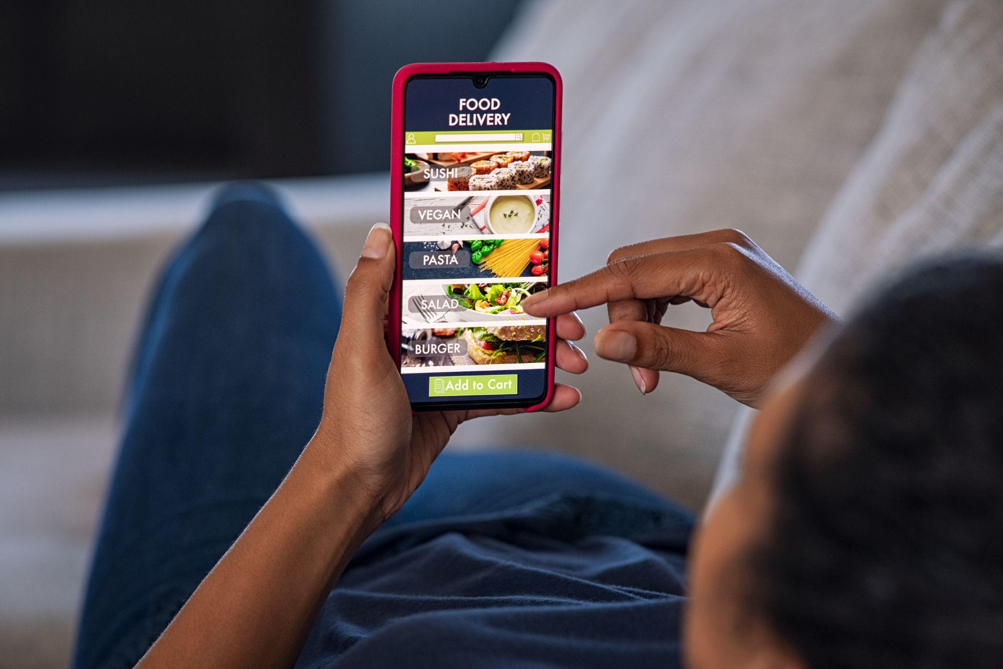 Smartphone displaying a Google Business Profile listing with business information and reviews
