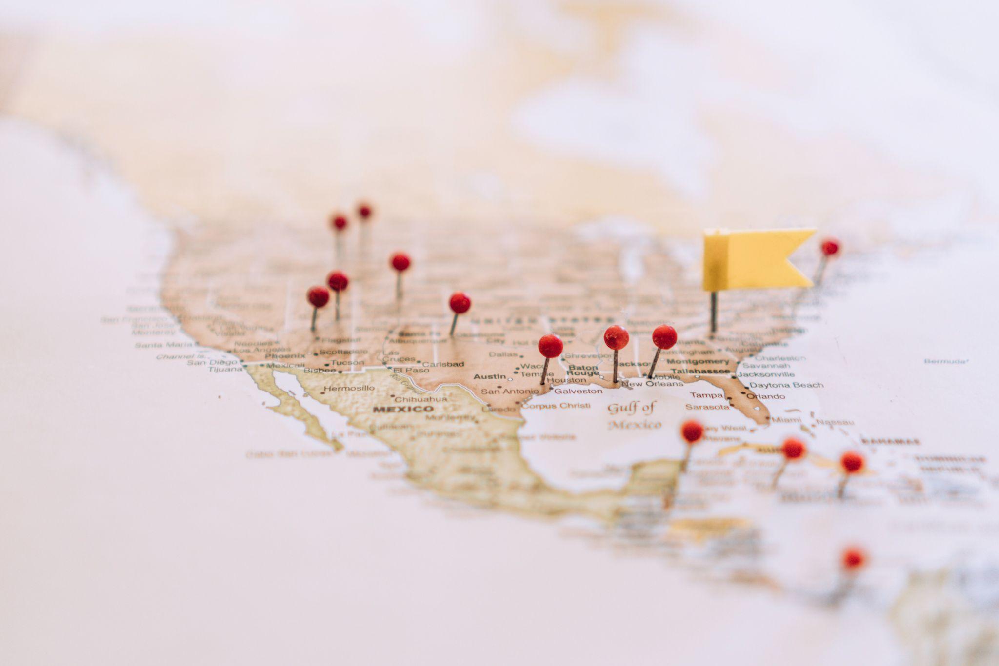 US map with multiple business location pins illustrating multi-location local SEO strategy